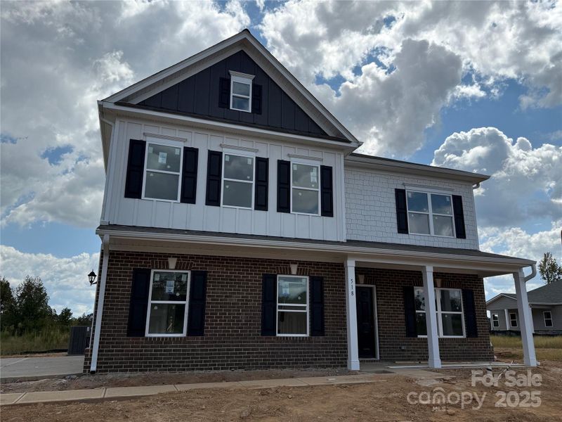 Front exterior of a new home in Cedar Meadows, Monroe, NC, highlighting curb appeal (Image 1). Front exterior of a new home in Cedar Meadows, Monroe, NC, highlighting curb appeal (Image 1).