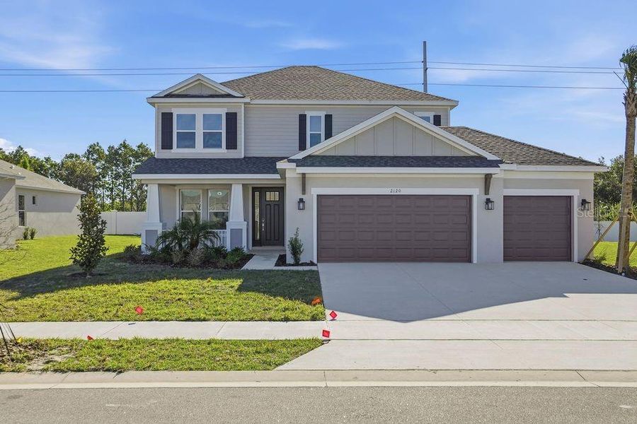 Front exterior of a new home in Brookland Park, Auburndale, FL, highlighting curb appeal (Image 17).