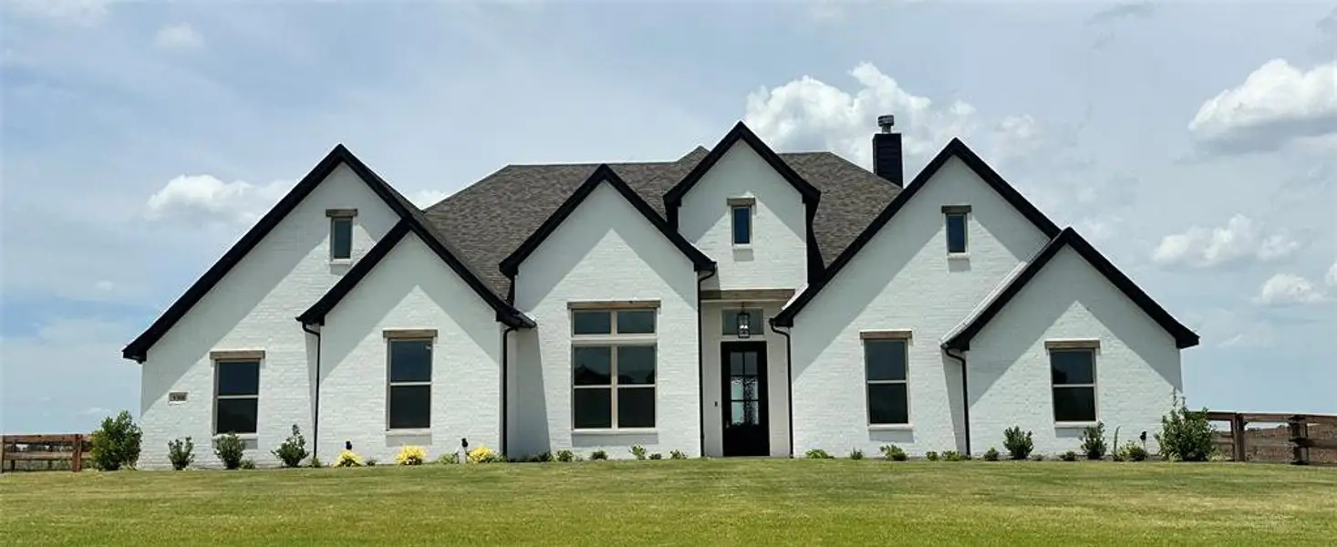 Front exterior of a new home in , Decatur, TX, highlighting curb appeal (Image 16). Front exterior of a new home in , Decatur, TX, highlighting curb appeal (Image 16).
