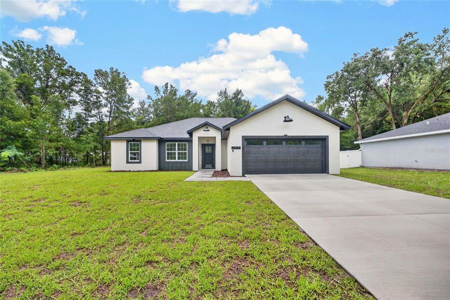 Front exterior of a new home in , Summerfield, FL, highlighting curb appeal (Image 20). Front exterior of a new home in , Summerfield, FL, highlighting curb appeal (Image 20).
