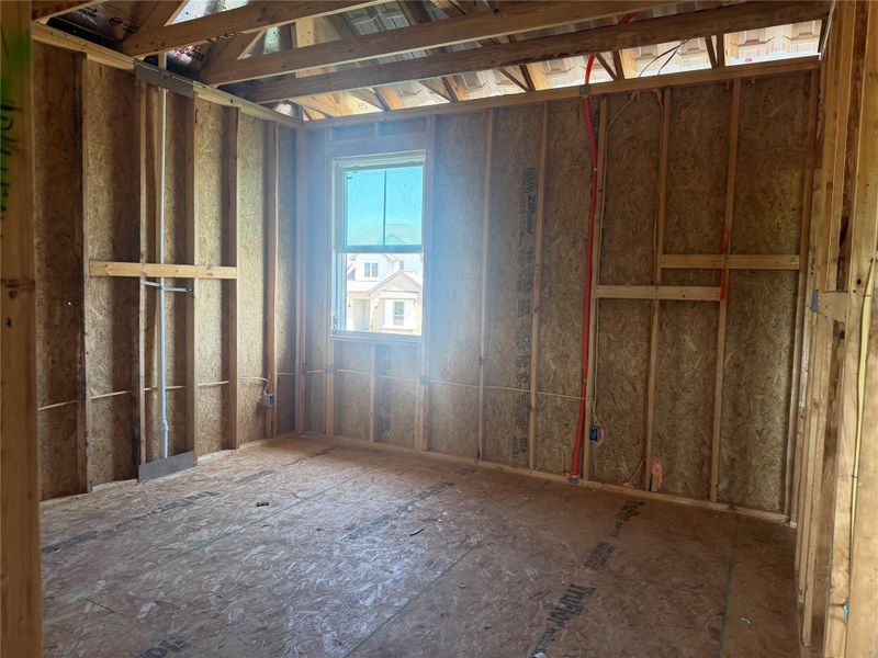 Exposed wood framing and subflooring define this unfinished space awaiting your custom design choices.