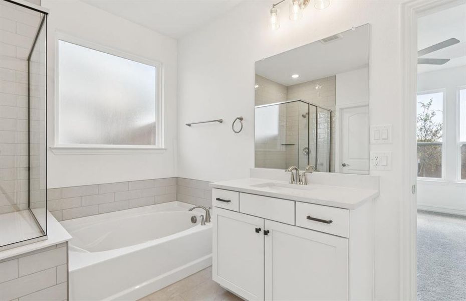 Separate vanities and large tub in owner's bath Separate vanities and large tub in owner's bath