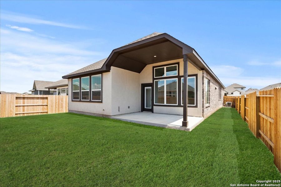 Front exterior of a new home in Meyer Ranch, New Braunfels, TX, highlighting curb appeal (Image 2). Front exterior of a new home in Meyer Ranch, New Braunfels, TX, highlighting curb appeal (Image 2).