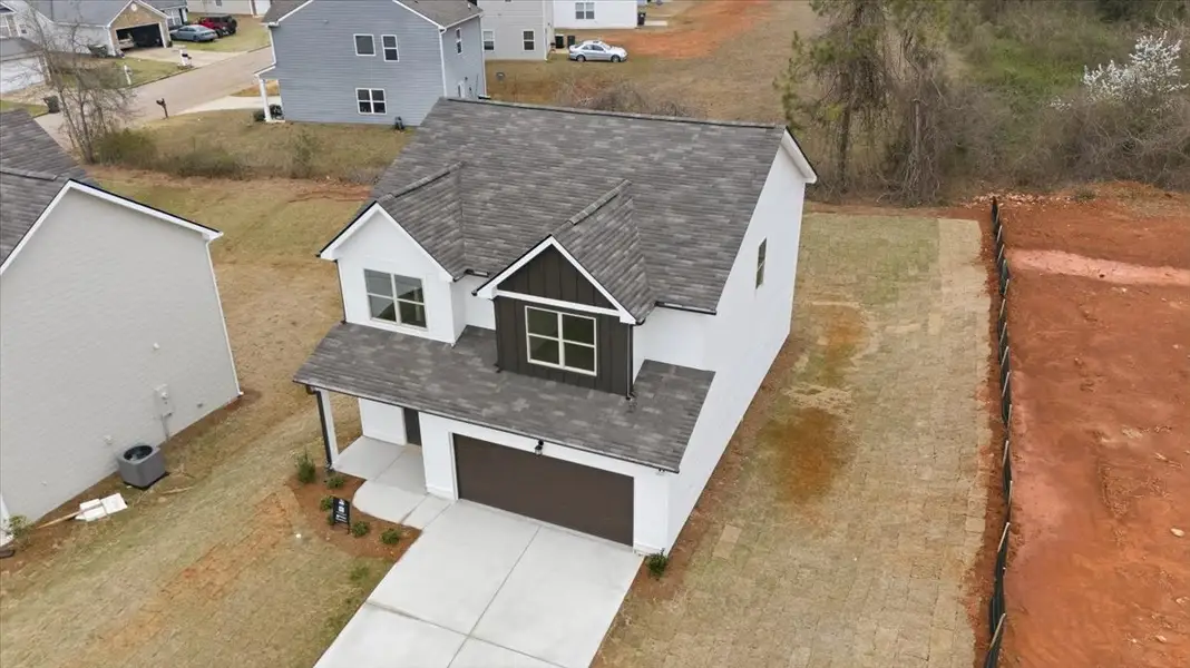 Front exterior of a new home in Creekside Manor, Thomaston, GA, highlighting curb appeal (Image 13). Front exterior of a new home in Creekside Manor, Thomaston, GA, highlighting curb appeal (Image 13).