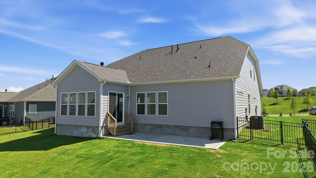 Exterior details and patio area of a home in Estates at Sugar Creek, Indian Land (Image 29).