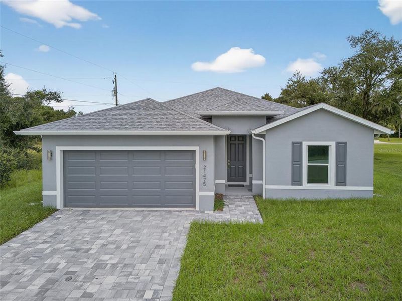 Front exterior of a new home in , Port Charlotte, FL, highlighting curb appeal (Image 2).