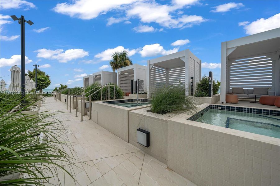 Front exterior of a new home in Aston Martin Residences, Miami, FL, highlighting curb appeal (Image 26).