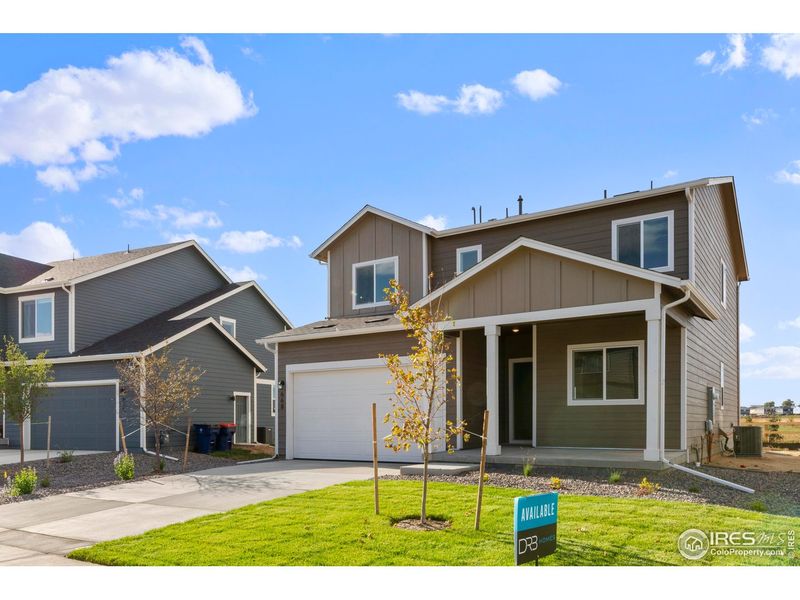 Front exterior of a new home in Granary, Johnstown, CO, highlighting curb appeal (Image 16).