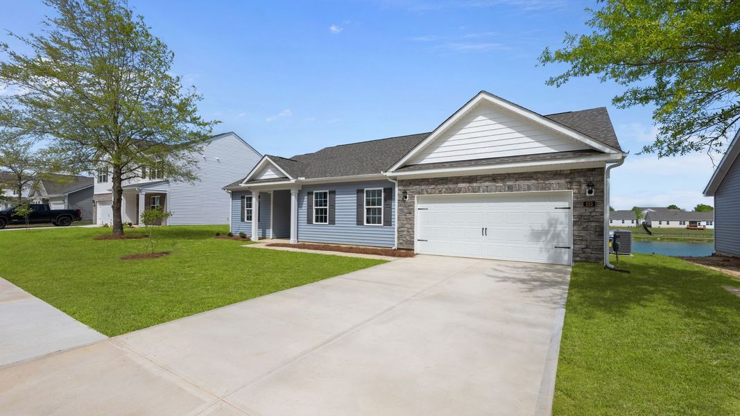 Front exterior of a new home in Tyler - Home on the Lake, New Bern, NC, highlighting curb appeal (Image 21).