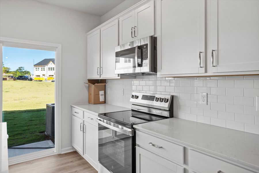 Furnished interior view inside a new home in West Main Townhomes, Sanford (Image 6).