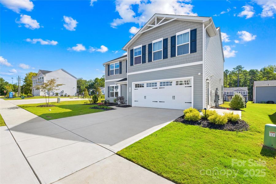 Front exterior of a new home in , Lancaster, SC, highlighting curb appeal (Image 15).