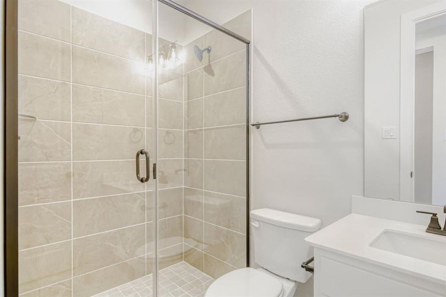 Full bathroom featuring vanity and a stall shower