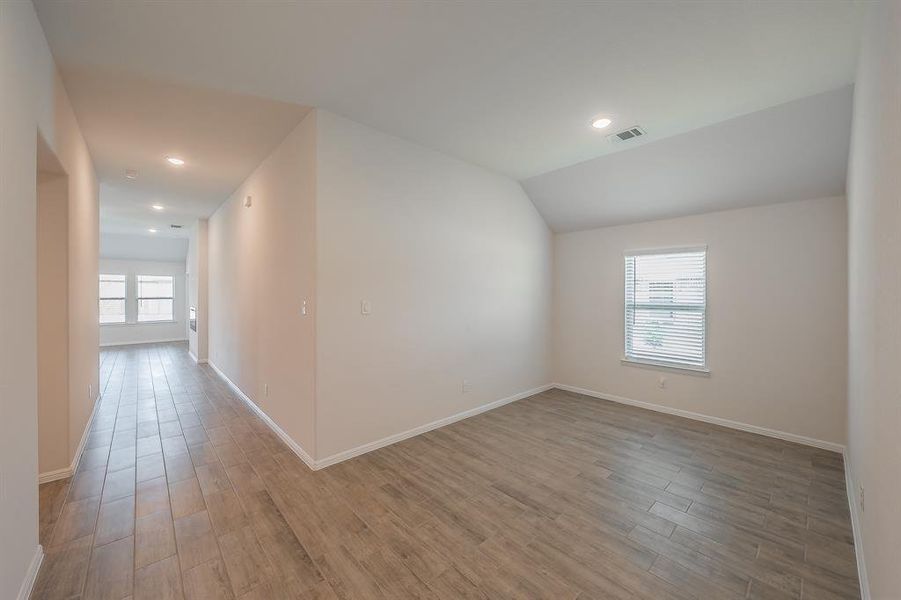 Bonus room with recessed lighting and light wood-style floors Bonus room with recessed lighting and light wood-style floors