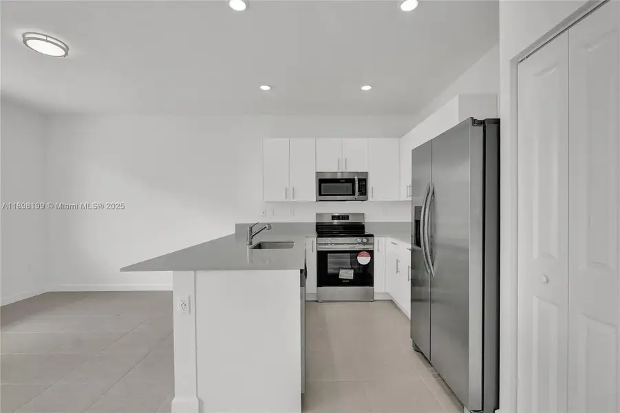 Furnished interior view inside a new home in , Homestead (Image 13). Furnished interior view inside a new home in , Homestead (Image 13).