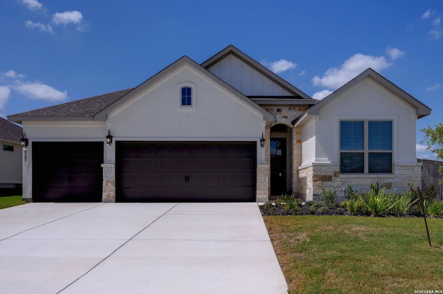 Front exterior of a new home in The Parklands, Schertz, TX, highlighting curb appeal (Image 25).
