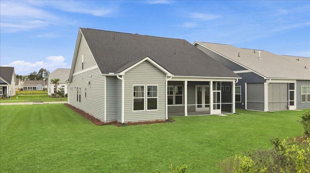 Exterior details and patio area of a home in Summerwind Crossing at Lakes of Cane Bay, Summerville (Image 3).