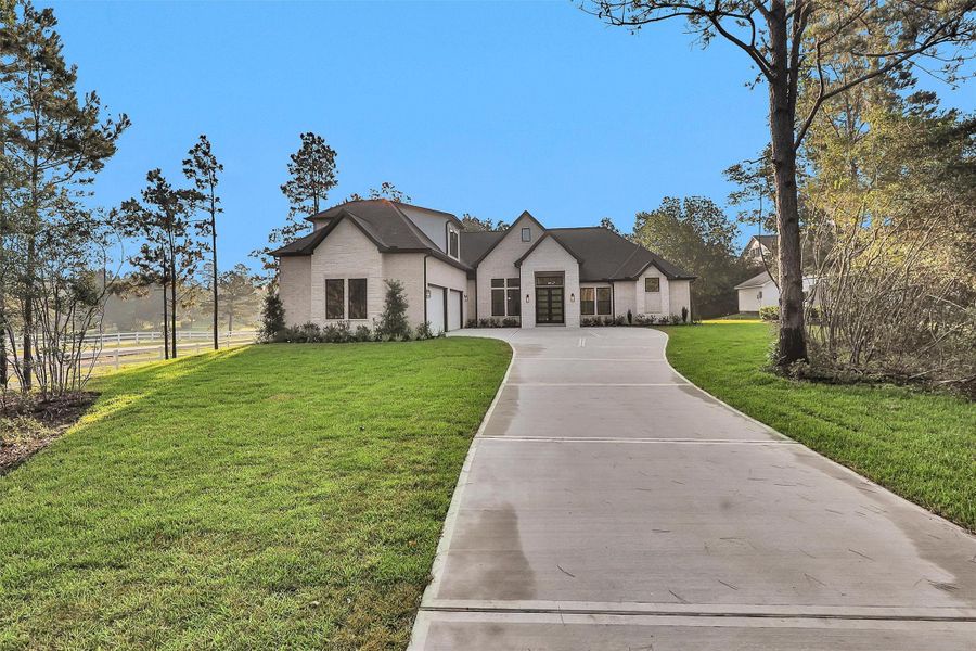 Front exterior of a new home in , Montgomery, TX, highlighting curb appeal (Image 20). Front exterior of a new home in , Montgomery, TX, highlighting curb appeal (Image 20).