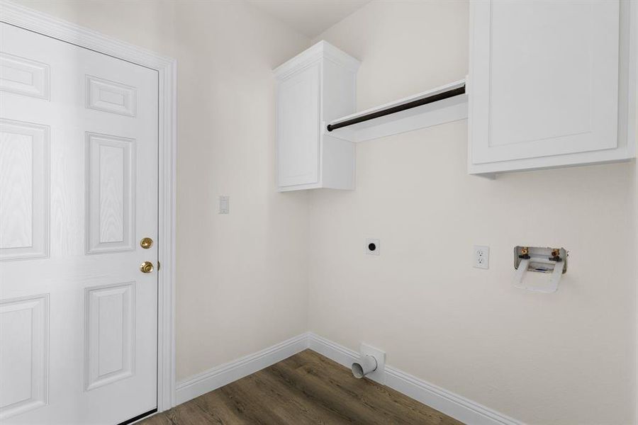 Laundry room with hookup for an electric dryer, dark hardwood / wood-style floors, and hookup for a washing machine