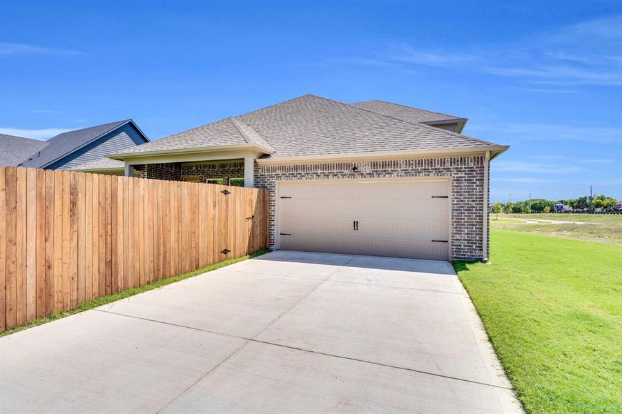 Front exterior of a new home in Ten Mile Creek Estates, DeSoto, TX, highlighting curb appeal (Image 22). Front exterior of a new home in Ten Mile Creek Estates, DeSoto, TX, highlighting curb appeal (Image 22).