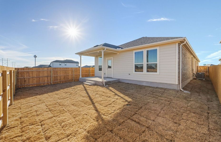 Exterior details and patio area of a home in Crosswinds, Kyle (Image 25).