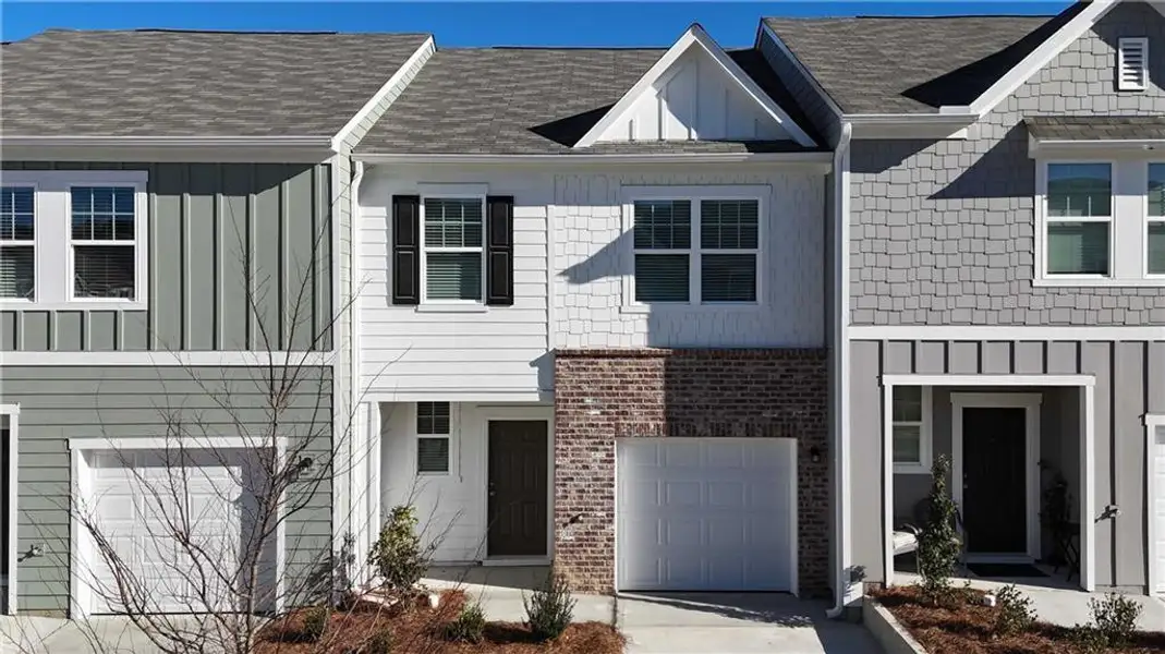 Front exterior of a new home in Kingston Cove, Auburn, GA, highlighting curb appeal (Image 2). Front exterior of a new home in Kingston Cove, Auburn, GA, highlighting curb appeal (Image 2).