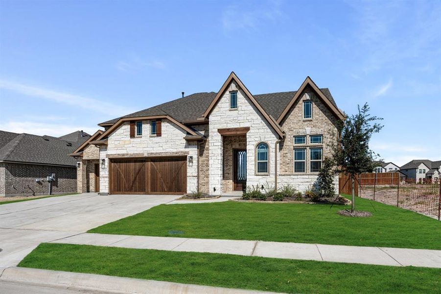 Front exterior of a new home in Stone River Glen 60s, Royse City, TX, highlighting curb appeal (Image 1). Front exterior of a new home in Stone River Glen 60s, Royse City, TX, highlighting curb appeal (Image 1).
