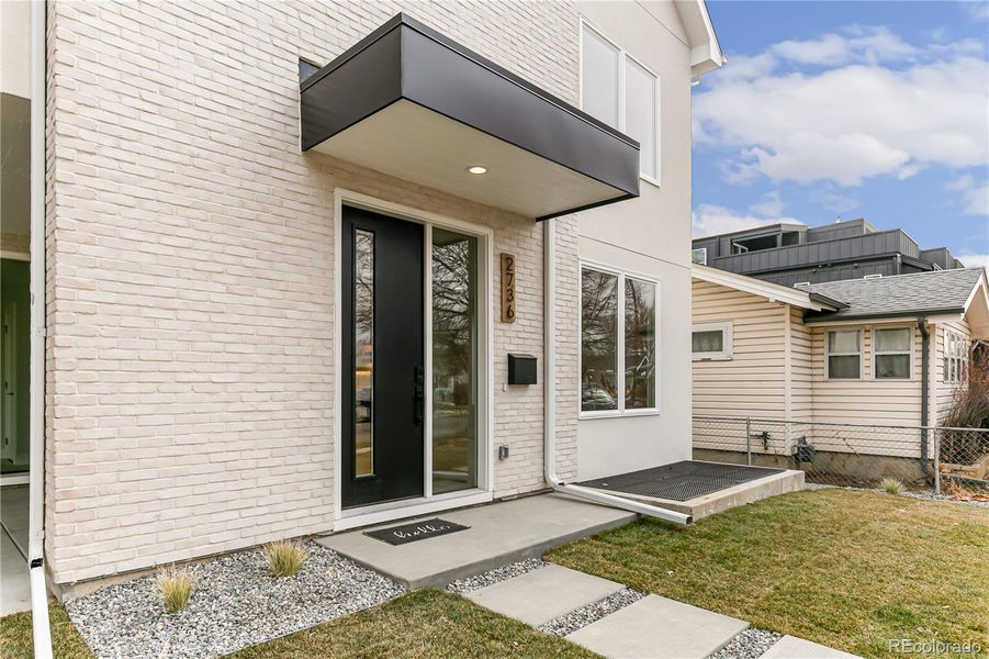 Exterior details and patio area of a home in , Englewood (Image 3).