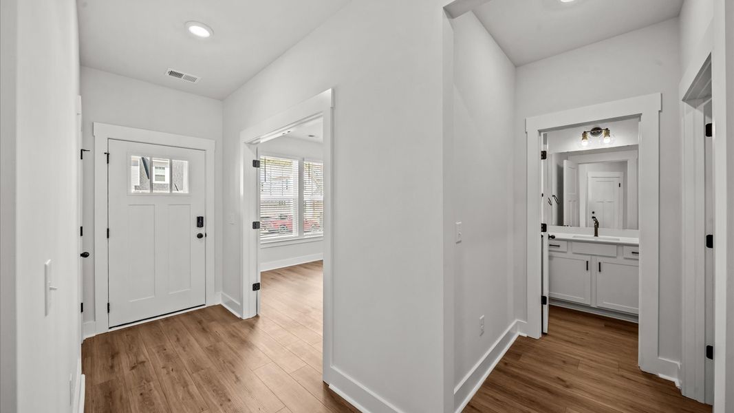 First-rate hardwood flooring greets you in a welcoming and elegant foyer