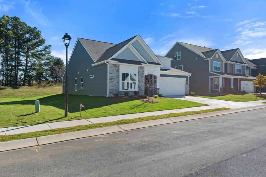 Front exterior of a new home in Wexford, Elon, NC, highlighting curb appeal (Image 18).