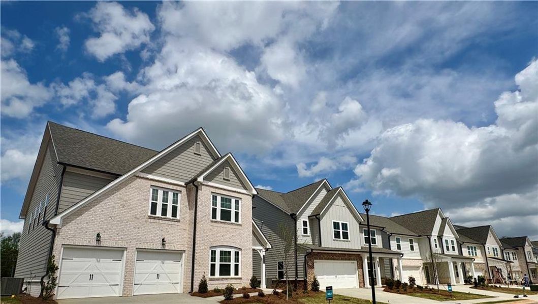 Front exterior of a new home in , Flowery Branch, GA, highlighting curb appeal (Image 6).