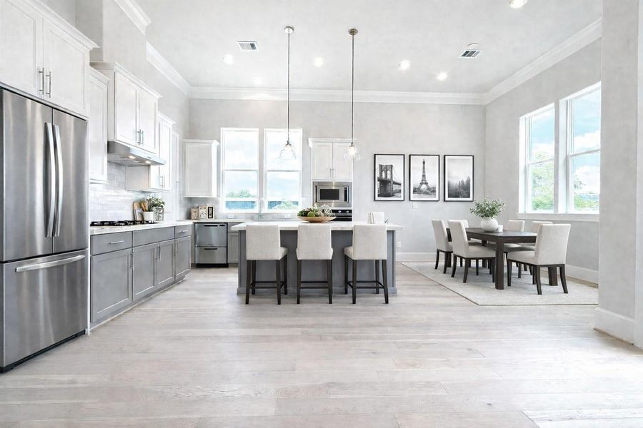 Virtually staged kitchen and dining area.