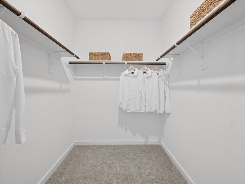 Primary walk-in closet (*Photo not of actual home and used for illustration purposes only.)