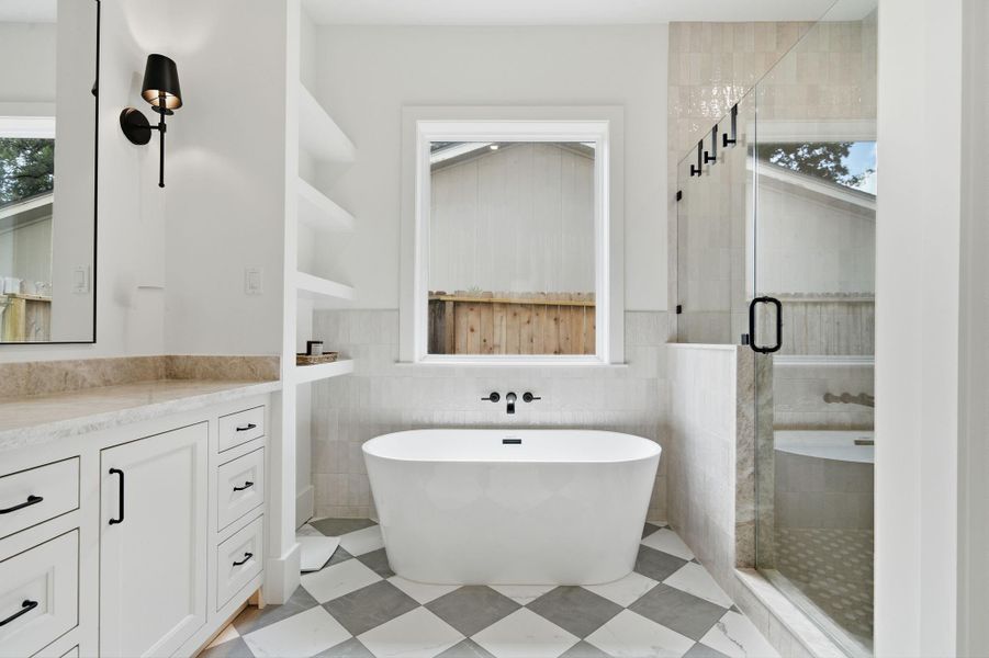 Separate soaking tub/shower and open shelves in the Primary Bathroom. Separate soaking tub/shower and open shelves in the Primary Bathroom.