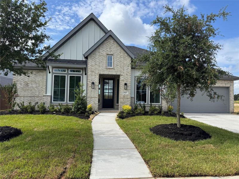 Front exterior of a new home in Legacy Prairie at Katy Court 65' & 70', Katy, TX, highlighting curb appeal (Image 24). Front exterior of a new home in Legacy Prairie at Katy Court 65' & 70', Katy, TX, highlighting curb appeal (Image 24).
