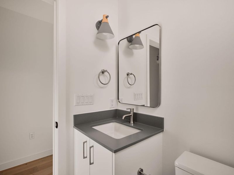Bathroom with vanity and wood finished floors