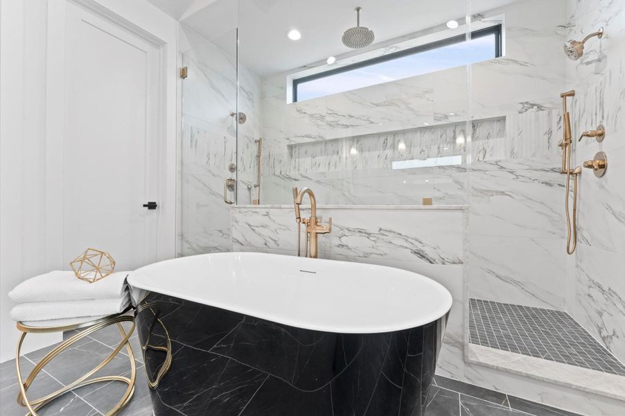 great black stand alone tub w/stand alone faucet