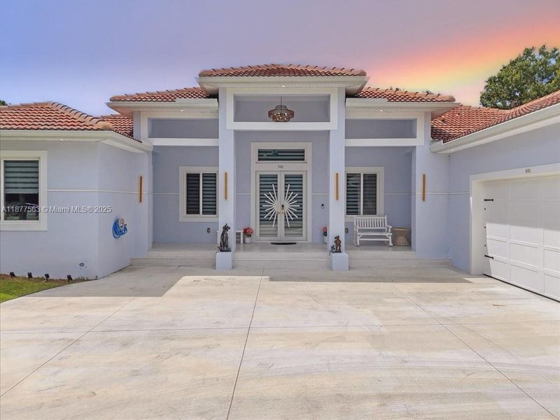 Front exterior of a new home in , Lehigh Acres, FL, highlighting curb appeal (Image 2).