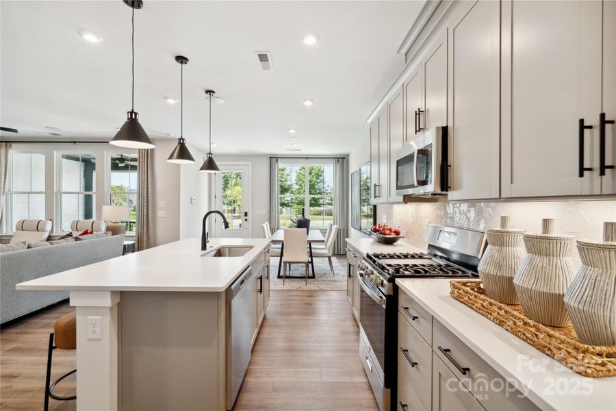 Large central island perfect for casual dining and meal preparation. *Model Photos | Actual finishes, structural selections, and orientation may vary. Large central island perfect for casual dining and meal preparation. *Model Photos | Actual finishes, structural selections, and orientation may vary.