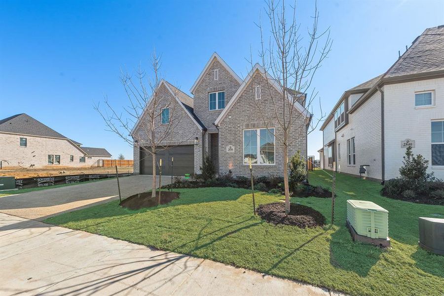 Front exterior of a new home in Brookhollow West, Prosper, TX, highlighting curb appeal (Image 2). Front exterior of a new home in Brookhollow West, Prosper, TX, highlighting curb appeal (Image 2).