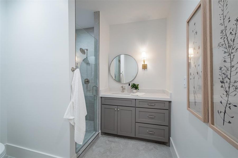 Bathroom featuring vanity and walk in shower