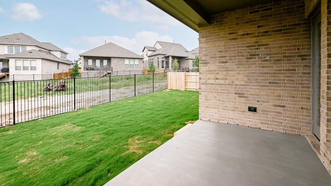 Exterior details and patio area of a home in 6 Creeks, Kyle (Image 22).