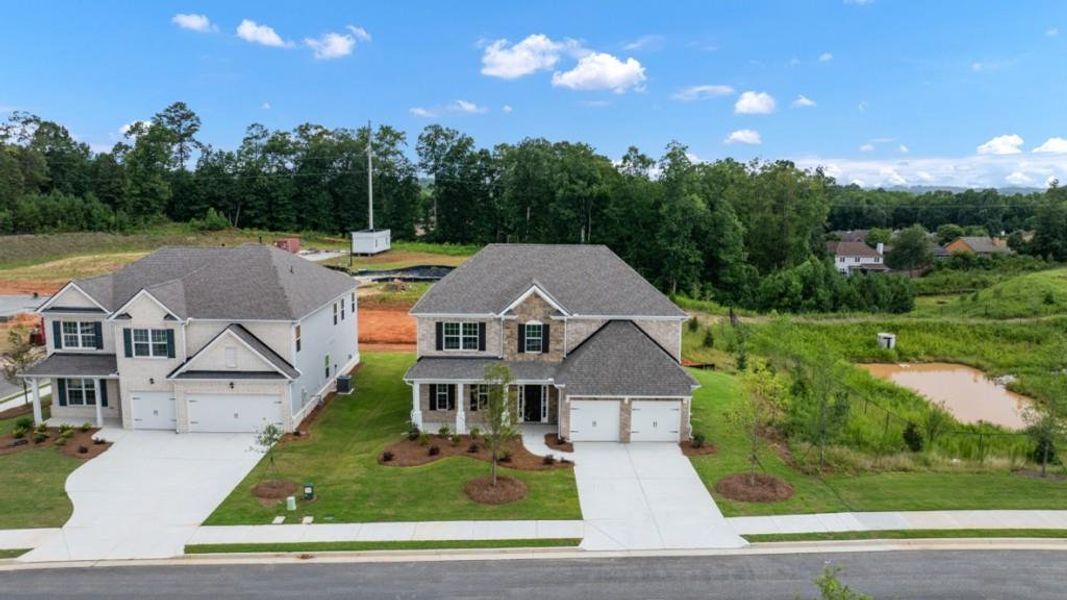 Front exterior of a new home in Butner Estates, South Fulton, GA, highlighting curb appeal (Image 24).