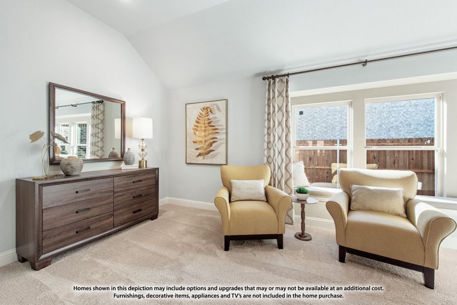 Bedroom sitting area with two accent chairs, wood dresser, vaulted ceiling, and large windows with patterned drapes Bedroom sitting area with two accent chairs, wood dresser, vaulted ceiling, and large windows with patterned drapes