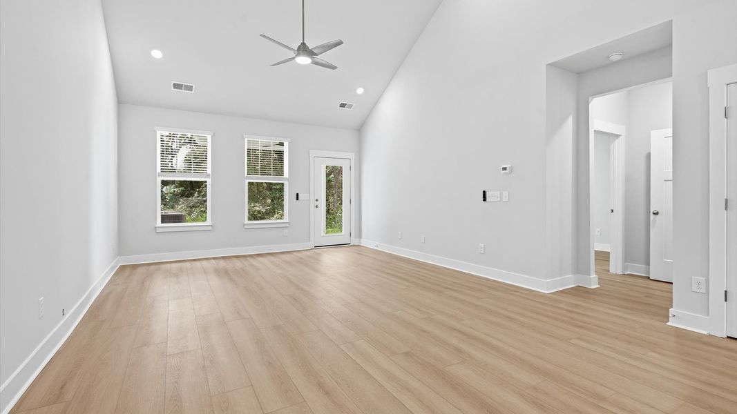 First-rate family room with eye-catching two-story ceilings and superior architectural detail