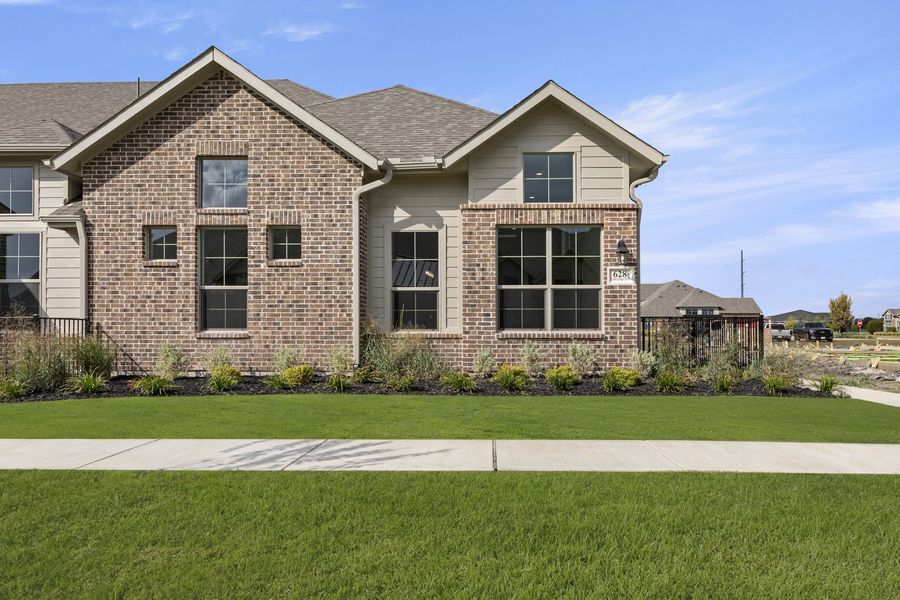 Front exterior of a new home in Woodbridge Villas, Wylie, TX, highlighting curb appeal (Image 1). Front exterior of a new home in Woodbridge Villas, Wylie, TX, highlighting curb appeal (Image 1).