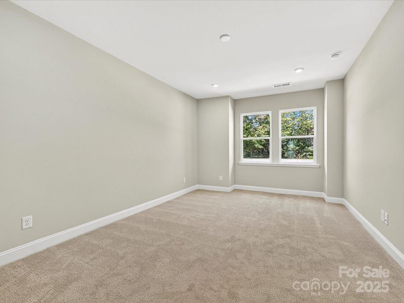 Primary Suite with 9' Ceilings and 8' Doorways.