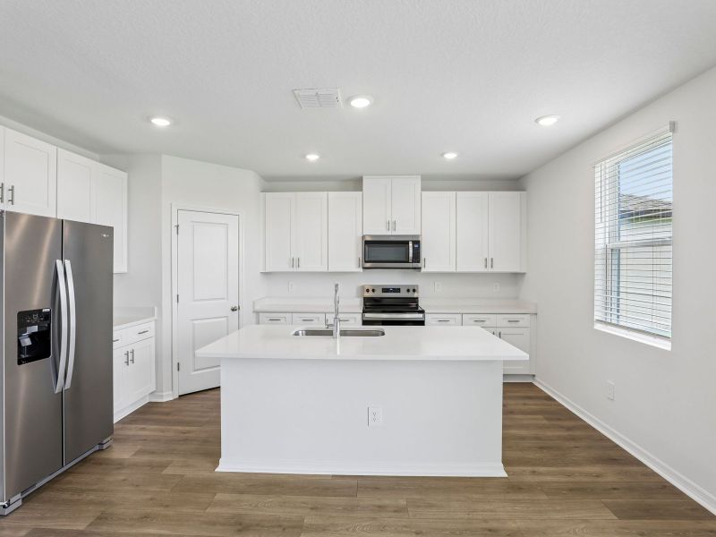 Furnished interior view inside a new home in Hilltop Vistas, Dade City (Image 4).