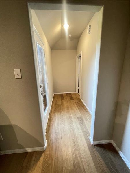 Hallway from living room to primary bedroom