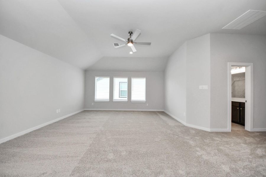 Come upstairs and enjoy a day of leisure in this fabulous game room! This is the perfect hangout spot or adult game room! Features plush carpet, high ceilings, custom paint and windows for plenty of natural light.