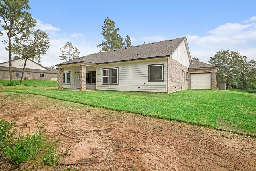 Front exterior of a new home in Oakwood Ranch, Willis, TX, highlighting curb appeal (Image 20). Front exterior of a new home in Oakwood Ranch, Willis, TX, highlighting curb appeal (Image 20).